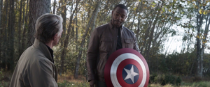 Falcon being given the shield by an elderly Steve.