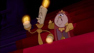 Lumière and Cogsworth seeing Belle leave the castle due having been frightened by Beast.