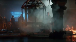 Grey, Weaver, Carver, Maya, Dempsey, Nikolai, Richtofen and Takeo witnessing The Warden putting down the skull in a chain cage.