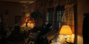 Lucas, Mike, and Max looking out a window before Hopper tells them to get away from it.