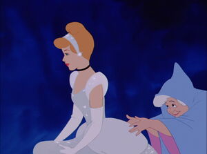 Cinderella being escorted by her Fairy Godmother to her carriage.