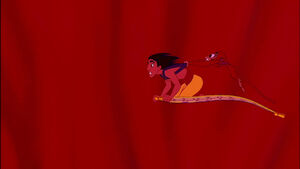 Carpet, Aladdin, and Abu heading towards the cave's exit.