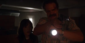 Joyce and Hopper finding two men working near a generator.