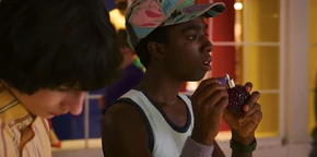 Lucas smelling some perfume.