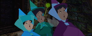 The fairies horrified to be confronted by Maleficent who manages to fulfill her curse.