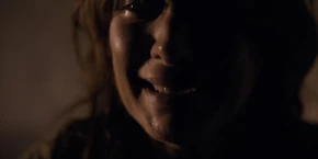 An overjoyed Joyce sobbing as she's happy to see Will is still alive.