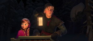 Anna and Kristoff checking behind the sled.