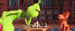 The Grinch and Max playing chess