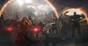 Miek with Korg, Valkyrie, Scarlet Witch, and the Asgardians to stop Thanos.