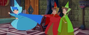 Fauna as Flora stops Merryweather from attacking Maleficent.