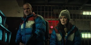 Joyce and Hopper confused on who Melnikov's referring to when he says the Mind Flayer's fragment went into "them" after it escaped containment.