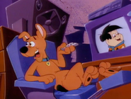 Fred Flintstone on Television as Scooby watches The Flinstone Kids.