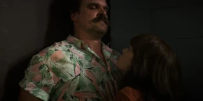 Joyce about to push Hopper aside so she can stop Alexei from escaping.