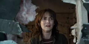 Joyce looking through the hole as she starts to breakdown.