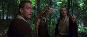 Jar Jar about to be persuaded by the Jedi to take them to Gungan City.