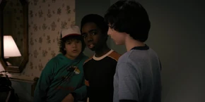 The boys waiting for El to finish changing into a new outfit.