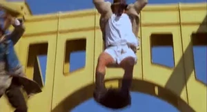 Inspector Gadget and Robogadget going airborne during their bridge fight.