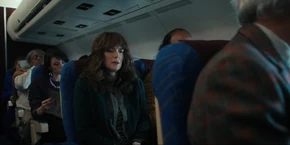 The next day, Joyce sits in a plane, flying to Alaska.