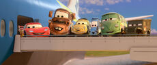 Lightning, Mater, Sarge, Fillmore, Luigi, and Guido about to board to Tokyo.