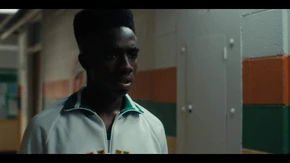 Lucas in deep thought after Max gives him back the ticket before going into the girls' bathroom.