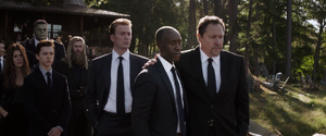 Rhodey with Happy Hogan and the others, attending Stark's funeral.