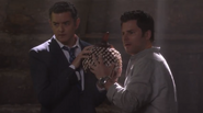 Lassiter and Shawn holding the Gourd of Transparency and solving crimes together.
