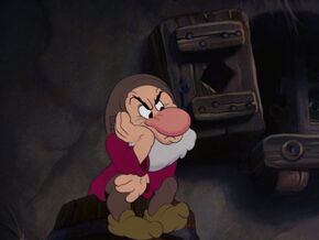 Grumpy watching the other dwarfs wash themselves.