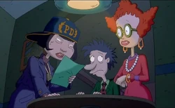 Didi and Stu being questioned by the police.