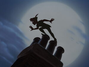 Peter Pan standing on a chimney.