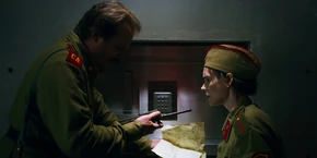 Joyce and Hopper suddenly hear Dustin contact his girlfriend, Suzie Bingham, asking for the number of Planck's Constant.