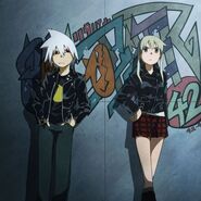 Maka and Soul dress in black jackets.