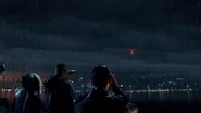 Stacker Pentecost, Tendo Choi, and Herman Gottlieb watch Gipsy fall from the Stratosphere.