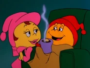 Ms. Pac-Man gives Pac-Man some Power Pellet Cocoa.