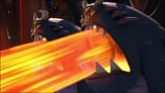 The twin gargoyles attack Dr. Buttocks