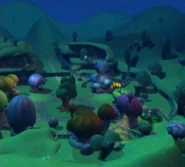 Full view of Pac-Village at night