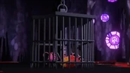 Suddenly a cage falls on the trio before they fight Fluffy