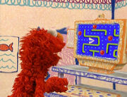 Elmo Playing Pac Man