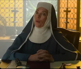 Reverend Mother at desk