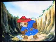 Paddington digging a hole