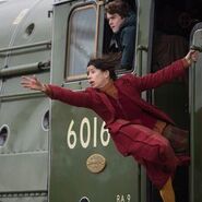 Mary reaches for Paddington from the train (Paddington 2)