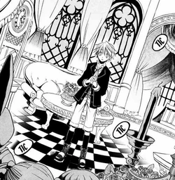 Oz surrounded by dolls