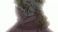 Little Miss Sinclair holding a little doll.