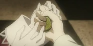 Alice & Oz hold the pocket watch together