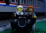 Tod Banston acting as Suave Bad Guy's get away driver in "Lego Train Chase (Stop Motion)".