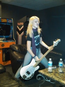 Hayley Williams playing a Ernie Ball Music Man Stingray Bass.