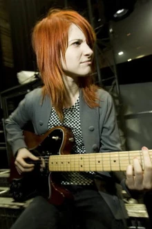 Hayley Williams playing a Fender Telecaster Deluxe Guitar.