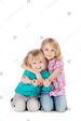 Stock-photo-two-cute-little-blond-sisters-kneeling-on-the-floor-arm-in-arm-cuddling-each-other-in-a-loving-145195801