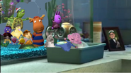 Dil getting placed in a tray and the Backyardigans and the Wonder Pets looking worried