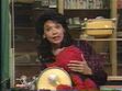 Elmo doses off in Maria's arms, drumming in his sleep at the end of episode 3776