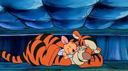 Tigger and Roo asleep under the bed